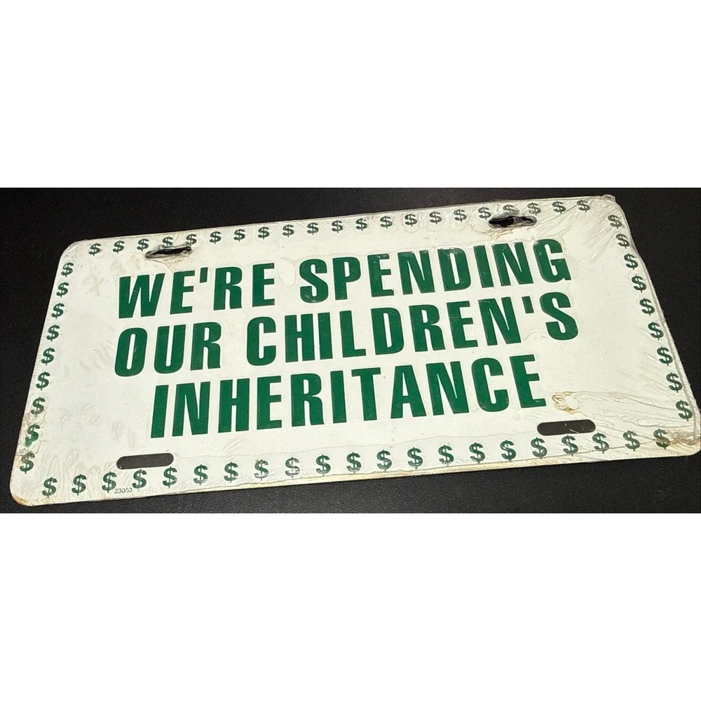 Vintage WE'RE SPENDING OUR CHILDREN'S INHERITANCE Booster License Plate